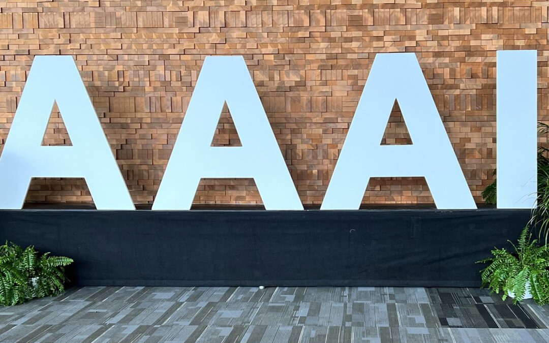 Large, silver AAAI letters from the lobby of the AAAI 24 Conference